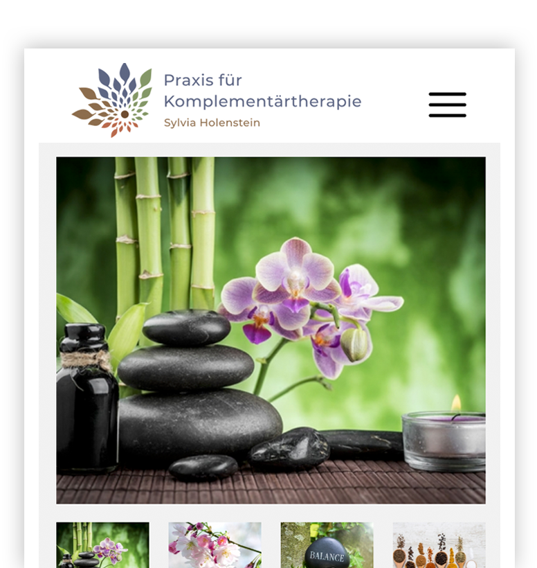 Gestapelte schwarze Spa-Steine, lila Orchidee, Bambushalme, Glasflasche und Teelichtkerze.